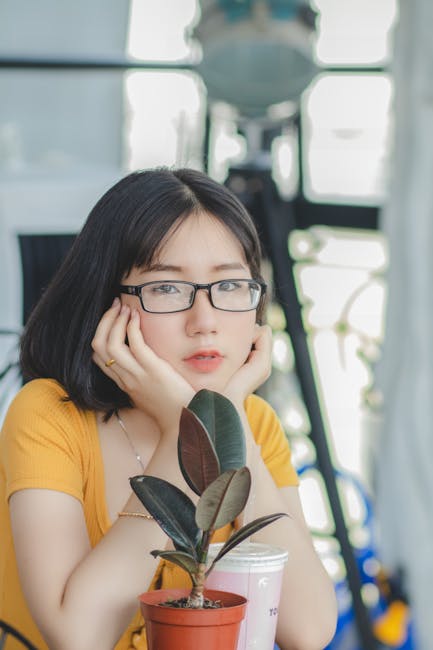 Woman sitting in a comfortable lotus pose with eyes closed